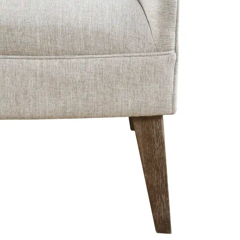 Beige-colored button-down fabric lounge chair