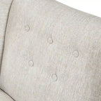 Beige-colored button-down fabric lounge chair